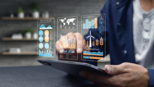 A person using a tablet with holographic digital dashboards showing sustainable energy and agriculture data.