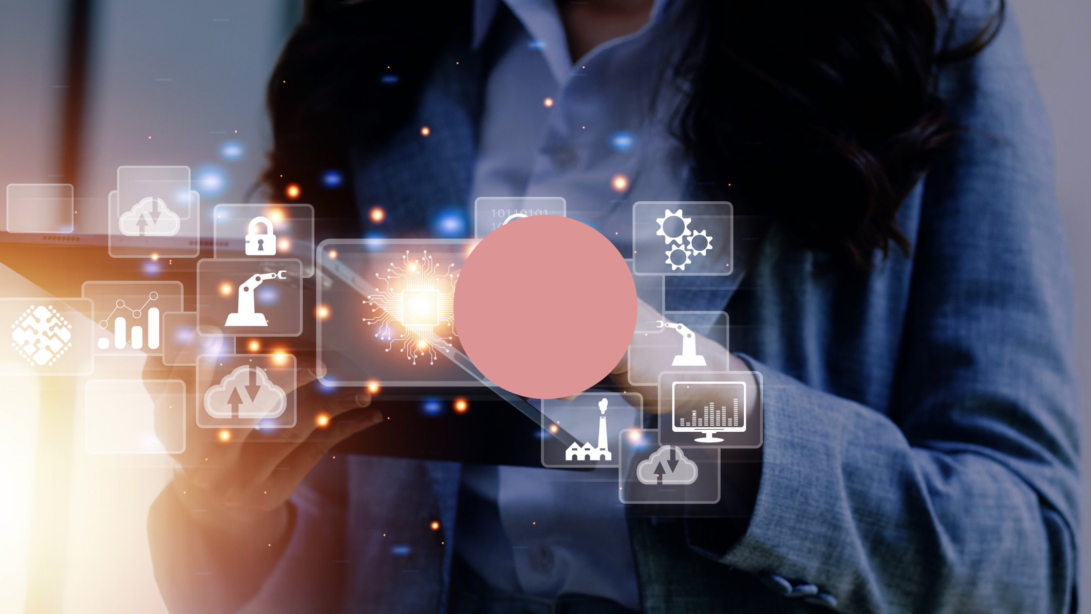 Close-up of a person in a suit holding a tablet with glowing digital icons representing cloud computing, analytics, security, and automation.